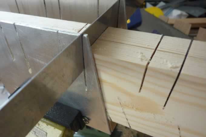 Eames Musical Tower Cutting Jig Eames Musical Tower Cutting Jig made from aluminium and pine, with a steel rule to hold the wood in register