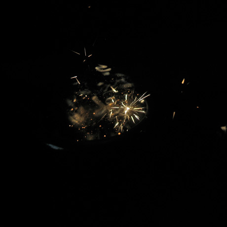 1/10000 sec shutter speed exposure of a lighter being lit, with the flint sparks frozen in time