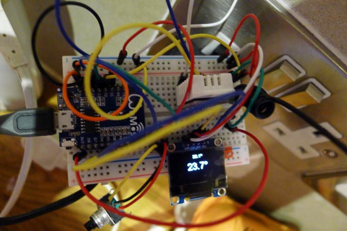 DIY Nest Esp8266 Thermostat installed on a breadboard fully working including display, 433MHz radio transmitter, DHT-22 sensor and rotary encoder