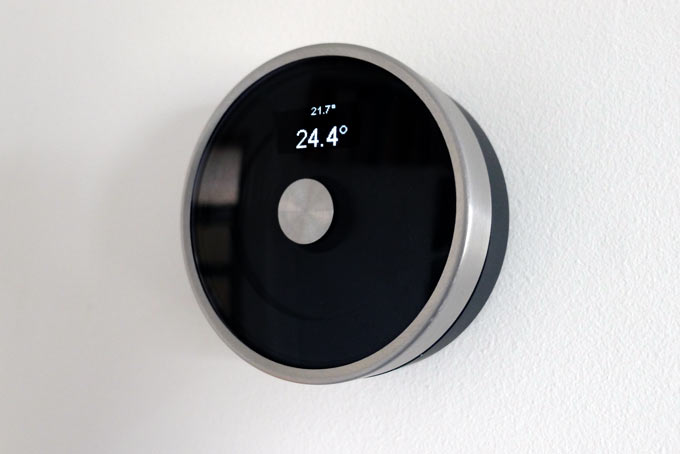 DIY Nest-style Thermostat with brushed steel circular housing showing simple OLED display